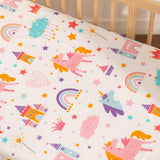 Close-up of whimsical fairytale print on soft cotton baby sheet with dreamy castles and stars
