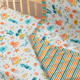 Detailed view of Under the Sea themed baby blanket with marine life patterns and soft fabric texture.