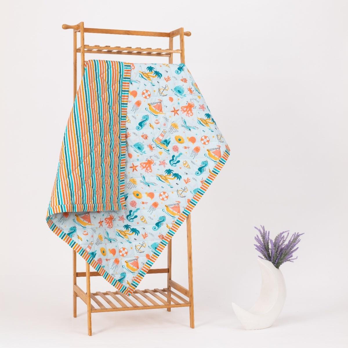 Lightweight baby comforter with Under the Sea ocean print – breathable and cozy for all seasons.