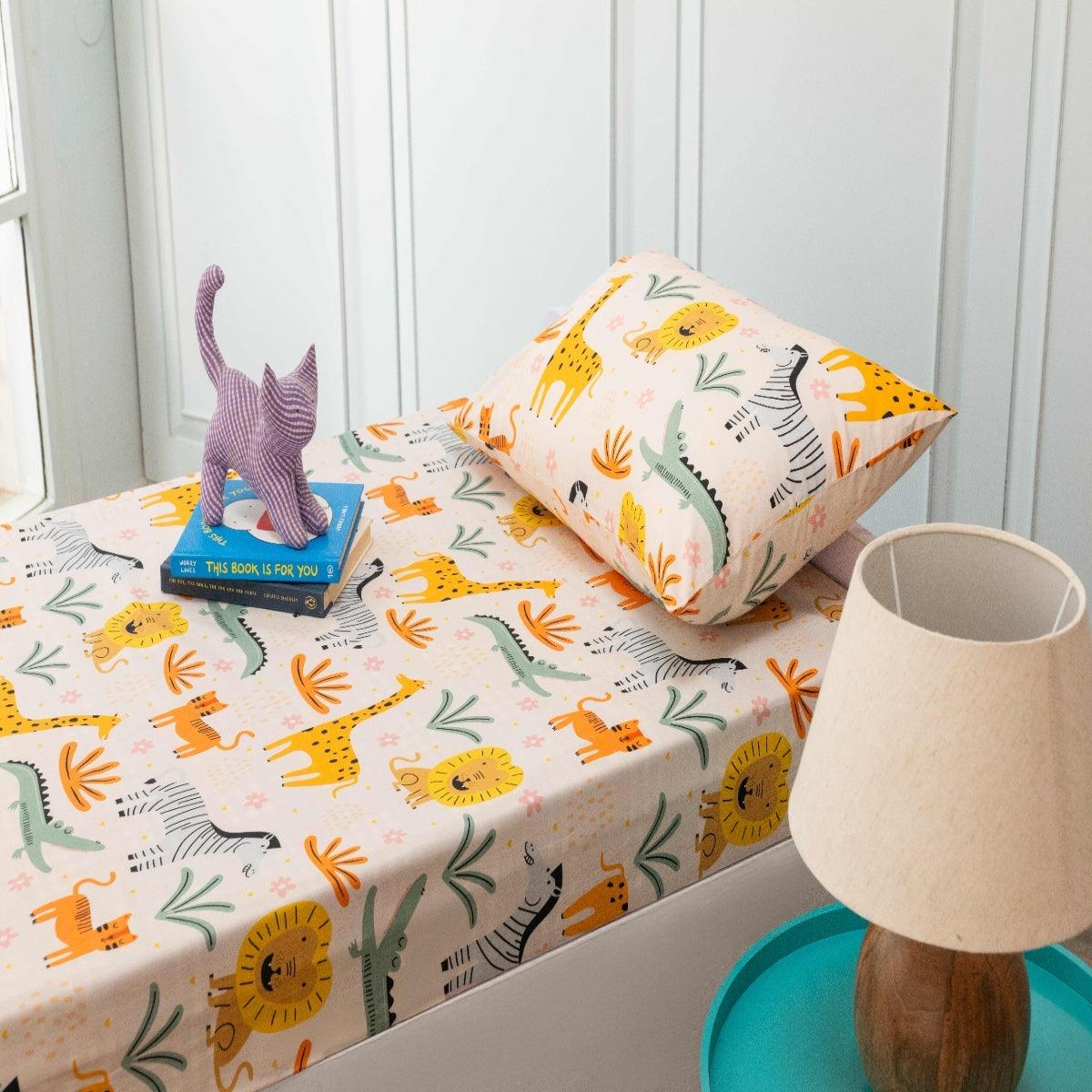 A kids bedroom showcasing a fully coordinated animal theme bedsheet, including pillowcase.