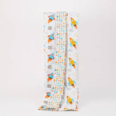 Reversible quilted kids blanket with outer space-themed print featuring stars, planets, and rockets.