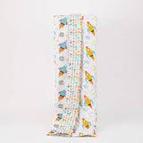 Reversible quilted kids blanket with outer space-themed print featuring stars, planets, and rockets.