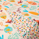 Close up image of ocean print kids comforter by playful plunge brand.