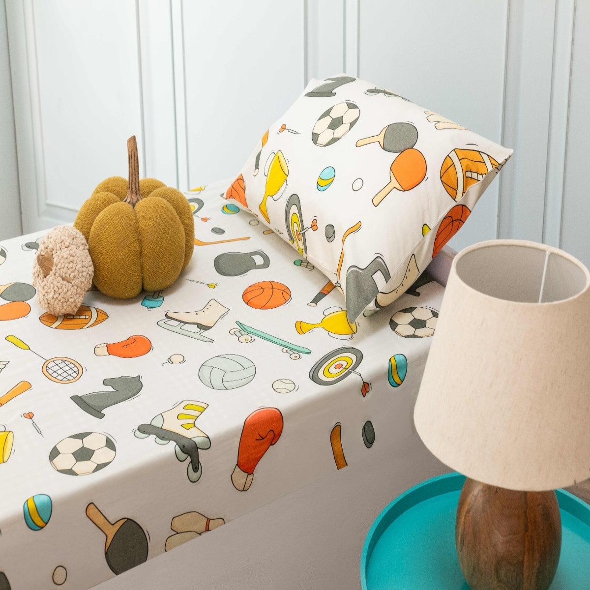 A bedroom showcasing a fully coordinated sports theme bedsheet for kid, including one pillowcase.