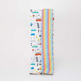 Reversible quilted kids blanket featuring transportation-themed prints with cars, buses, and road signs.