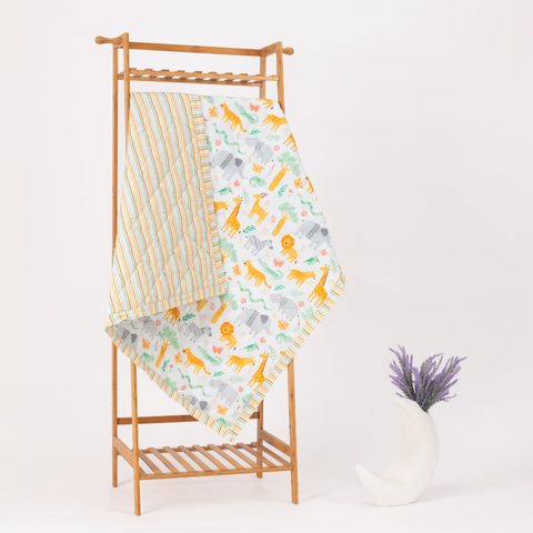 Reversible cotton baby blanket with Jungle Safari print – perfect for crib or stroller use. Shop at playful plunge