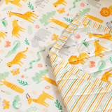 Close-up of Jungle Safari baby blanket showing animal motifs and natural green tones.