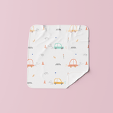 Muslin baby wipe featuring colorful car print – gentle, reusable cloth for babies.