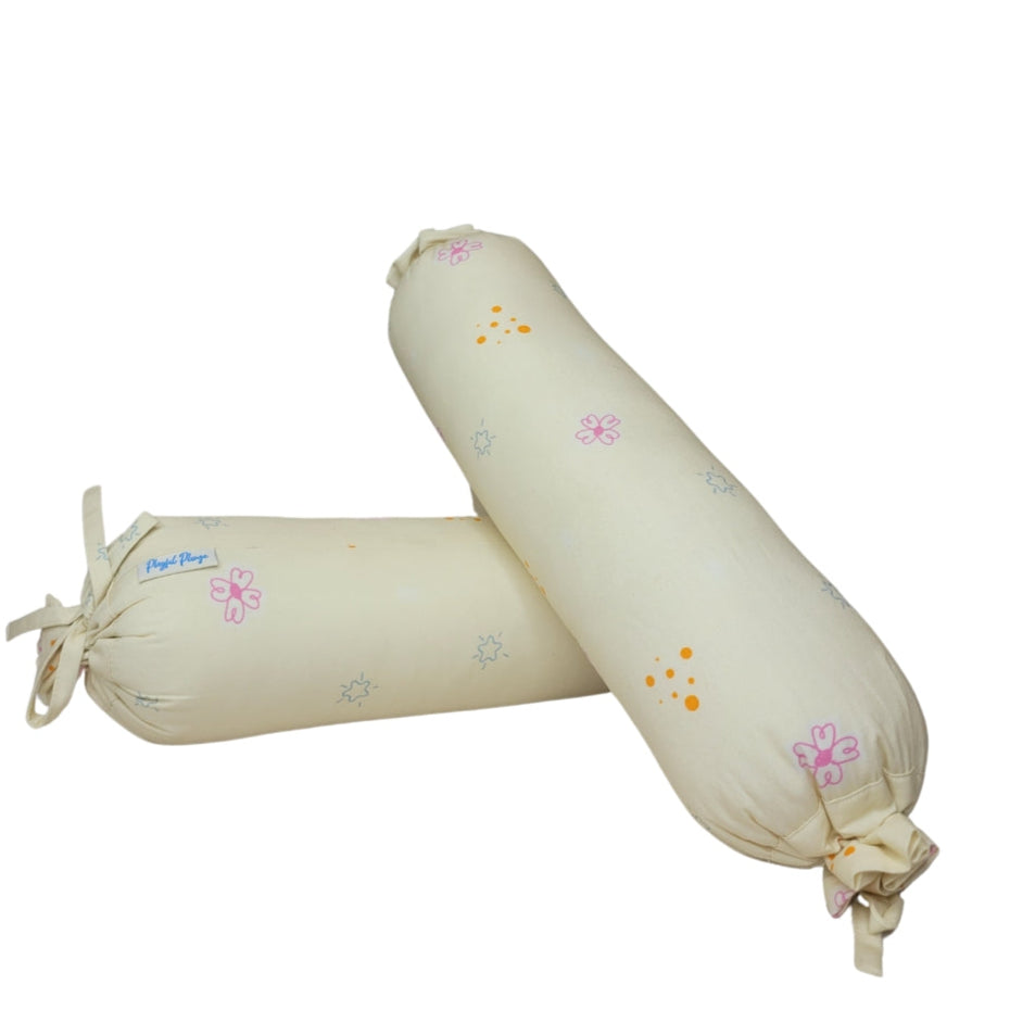 Two bolsters in soft fabric with fairytale motifs designed for baby support and comfort