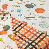 close-up image showing the print of sport equipment on kids comfort I Colour full kid blanket. 